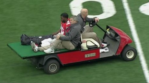 Ohio State quarterback J.T. Barrett carted off the field after injury against Michigan.