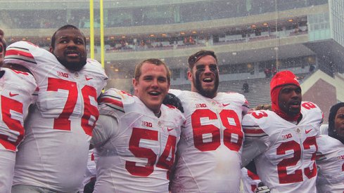 Ohio State's players celebrate a win in frigid Minnesota. 