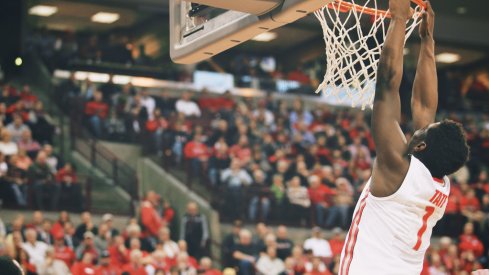 Jae'Sean Tate hangs on the rim.