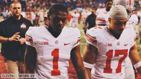 Dontre Wilson and Jalin Marshall walk off the field.