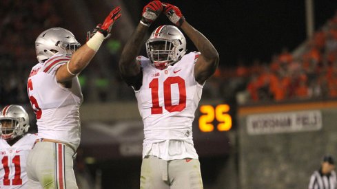 Sam Hubbard and Jalyn Holmes celebrate at Virginia Tech