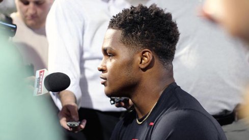 Raekwon McMillan talks to the media.