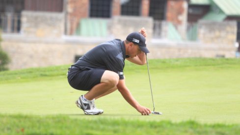 Sophomore Josh Wick Lining Up A Putt 