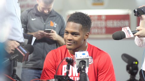 Raekwon McMillan talks to the media.