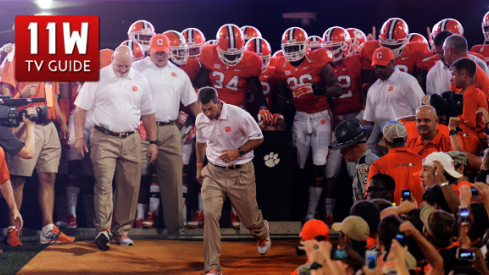 Dabo Swinney leads Clemson's players down the hill for the game against Georgia in 2013.