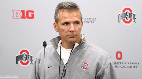 Urban Meyer talks to reporters Wednesday.