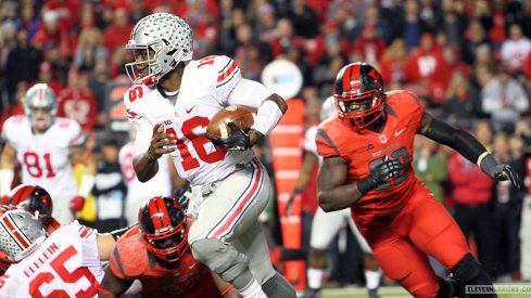 J.T. Barrett carries the ball vs. Rutgers.