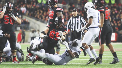 Pat Elflein puts a Nittany Lion to the turf.