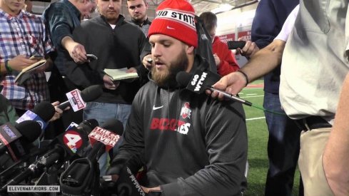 Taylor Decker speaks to the media. 