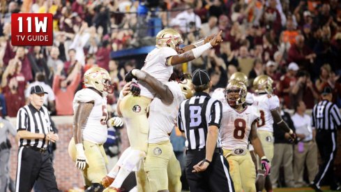 OCT. 19, 2013: Florida State's quarterback Jameis Winston celebrates a touchdown during the Florida State Seminoles and Clemson Tigers game at Memorial Stadium in Clemson, South Carolina. Florida State beat Clemson 51-14. 