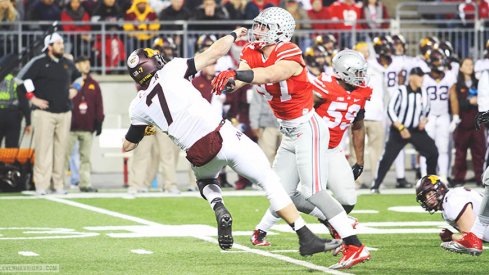 Joey Bosa blasts Minnesota quarterback Mitch Leidner in the first half of Saturday night's game.