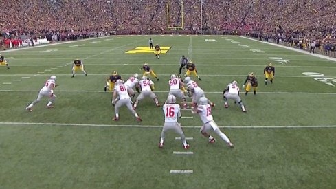 Ezekiel Elliott breaks Michigan up the middle.