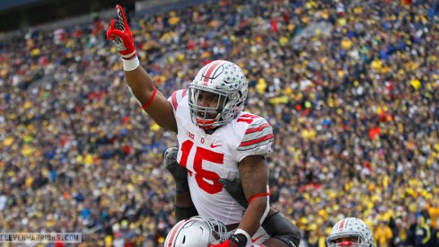 Ezekiel Elliott celebrates a touchdown run against Michigan. 