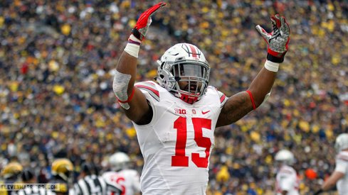 Ezekiel Elliott celebrates in front of Michigan crowd