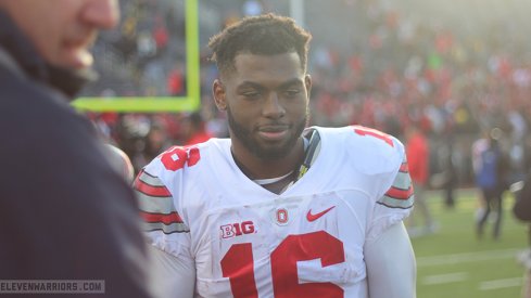 J.T. Barrett walks off the field after beating Michigan.