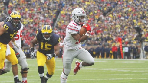 Ezekiel Elliott ran around and through Michigan's defense with 214 yards and two scores. 