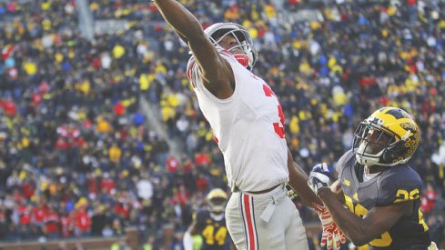 Mike Thomas tries to make a play against Jourdan Lewis.