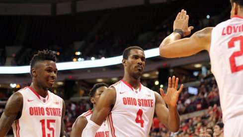 Kam Williams, Daniel Giddens and Marc Loving walk off the floor. 