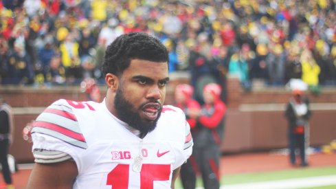 Ezekiel Elliott strolls the sidelines vs. Michigan.