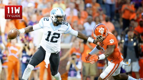 September 27, 2014: North Carolina quarterback Marquise Williams tries to elude a pass rush from Clemson.