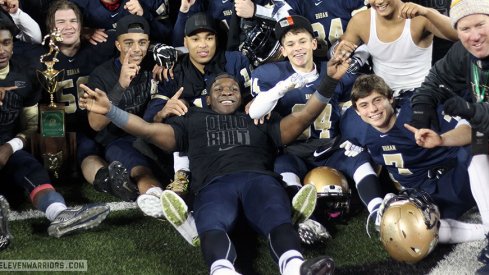 Todd Sibley and Akron Hoban celebrate their first state title.