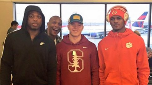 Eddie George photobombed Derrick Henry, Christian McCaffrey and Deshaun Watson at the airport.