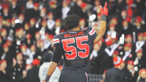 Cam Williams runs out on the field vs. Penn State.