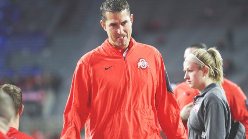 Luke Fickell strolls the sidelines.