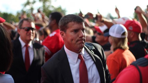 How Chris Ash is juggling two jobs in his final days at Ohio State.