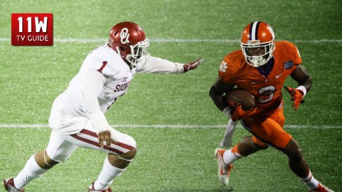 Dec 29, 2014: Orlando, FL USA; Clemson Tigers wide receiver Artavis Scott (3) attempts to run around Oklahoma Sooners linebacker Dominique Alexander (1) during the third quarter of the Russell Athletic Bowl at the Florida Citrus Bowl Stadium. Clemson defeated Oklahoma 40-6.