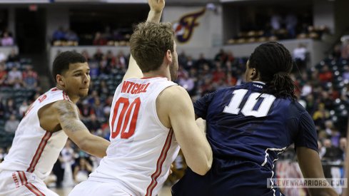 Marc Loving and Mickey Mitchell apply defensive pressure against Penn State