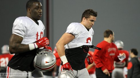 Sam Hubbard and Jaylyn Holmes during Ohio State's spring practice Tuesday.