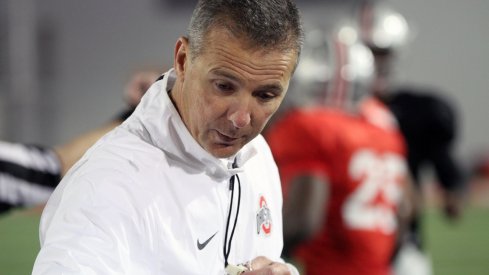 Urban Meyer addresses his team during spring practice.