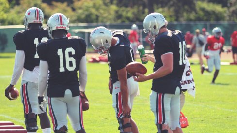 The participants of #QBGeddon stand together.