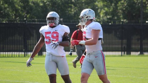 Tyquan Lewis and Sam Hubbard at fall camp practice. 