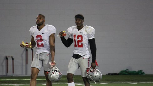 Marshon Lattimore, Denzel Ward walk off the Ohio State practice field. 