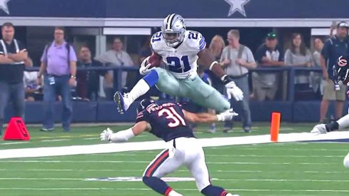 Ezekiel Elliott skies over the Bears' Chris Prosinski