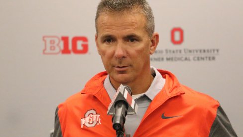 Urban Meyer addresses the media. 