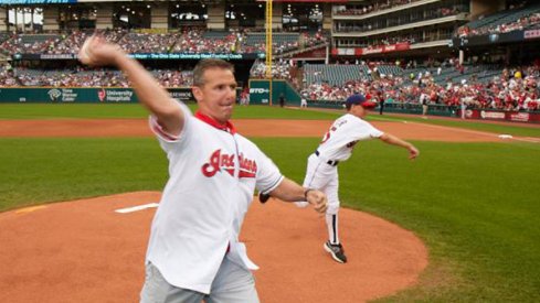 Urban Meyer, seen here throwing out the first pitch at an Indians game, is a huge baseball fan.
