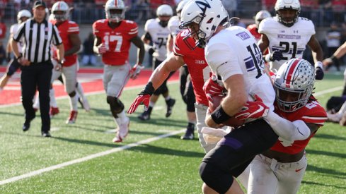 Malik Hooker makes a tackle against Northwestern.