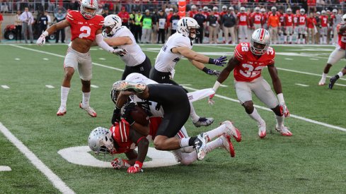 Eric Glover-Williams makes a tackle against Northwestern.