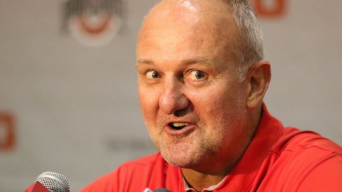 Thad Matta talks with reporters.