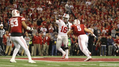 JT Barrett throws a pass against Wisconsin