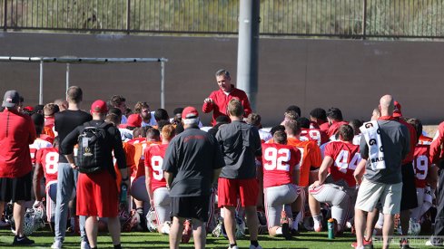 Urban Meyer talks to his team prior to Ohio State's practice Tuesday afternoon. 