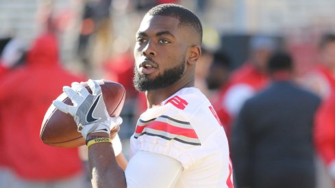 Ohio State quarterback J.T. Barrett warms up for a game earlier this season. 