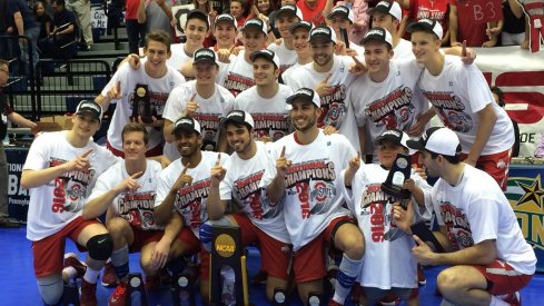 The Ohio State Men's Volleyball team poses with the national championship trophy after clinching the victory over BYU in 2016.