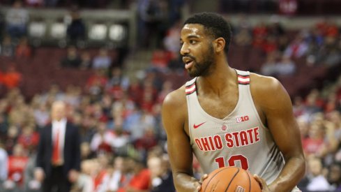 Ohio State point guard JaQuan Lyle pump fakes against Minnesota. 