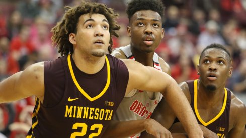 Ohio State's Andre Wesson goes up against a pair of Minnesota defenders. 