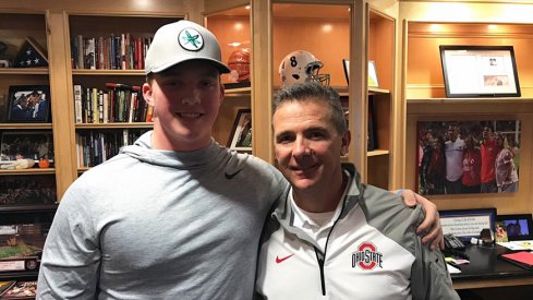 Minneapolis Edna Senior sophomore offensive tackle Quinn Carroll with Urban Meyer in the coach's office.