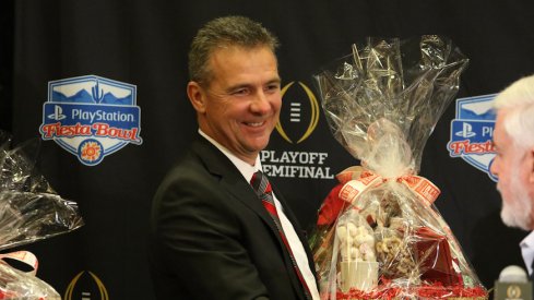 Urban Meyer receives $160,000 retention bonus, sees buyout in contract drop nearly $6.1 million on Wednesday.